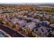 Stunning twilight aerial view of a vibrant neighborhood showcasing modern homes and illuminated streets at 12367 Aster Hills Ave, Las Vegas, NV 89138