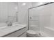 Modern bathroom features a glass shower, white tile, and vanity at 12367 Aster Hills Ave, Las Vegas, NV 89138