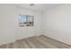 Clean bedroom with a window, hardwood-style floors, and modern finishes at 12367 Aster Hills Ave, Las Vegas, NV 89138