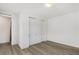 Bedroom with plank flooring and a large closet with bi-fold doors at 12367 Aster Hills Ave, Las Vegas, NV 89138