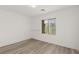 Bright bedroom featuring wood-look flooring and a window with lovely natural light at 12367 Aster Hills Ave, Las Vegas, NV 89138