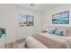 Bedroom with a view, plush bed, and neutral color scheme at 12367 Aster Hills Ave, Las Vegas, NV 89138