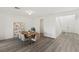 Inviting dining room featuring a rustic wood table and neutral-toned chairs at 12367 Aster Hills Ave, Las Vegas, NV 89138