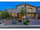 Contemporary home with a stylish exterior, desert landscaping, and a two-car garage at 12367 Aster Hills Ave, Las Vegas, NV 89138