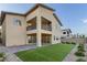 Back exterior view featuring a patio, balcony, and landscaped yard at 12367 Aster Hills Ave, Las Vegas, NV 89138