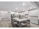 Spacious kitchen featuring a large marble island with seating and plenty of counter space at 12367 Aster Hills Ave, Las Vegas, NV 89138
