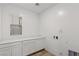 Laundry room with ample counter space, storage, and modern fixtures at 12367 Aster Hills Ave, Las Vegas, NV 89138