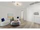 Comfortable loft space features a stylish seating area and wood-look floors at 12367 Aster Hills Ave, Las Vegas, NV 89138