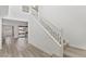 Modern staircase with white railings and wood flooring leading to the second floor at 12367 Aster Hills Ave, Las Vegas, NV 89138