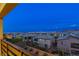 Evening view of the neighborhood and city skyline from the balcony at 12367 Aster Hills Ave, Las Vegas, NV 89138