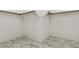 Empty walk-in closet with white walls and marble-patterned tiled flooring at 12367 Aster Hills Ave, Las Vegas, NV 89138