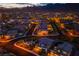Night aerial showcases the city and community, featuring lush landscapes and parks at 12404 Aster Hills Ave, Las Vegas, NV 89138