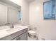 A clean, modern bathroom showcasing a stylish vanity and white marble flooring at 12404 Aster Hills Ave, Las Vegas, NV 89138