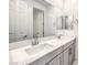 Modern bathroom with dual sinks, white countertops, and plenty of cabinet space at 12404 Aster Hills Ave, Las Vegas, NV 89138