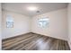 Bright, airy bedroom with wood-look floors and generous windows, offering pleasant views at 12404 Aster Hills Ave, Las Vegas, NV 89138