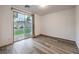 This is an empty bedroom featuring a sliding glass door to the backyard at 12404 Aster Hills Ave, Las Vegas, NV 89138