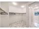 Organized walk-in closet featuring rods and shelves with tile floors, adding practicality at 12404 Aster Hills Ave, Las Vegas, NV 89138