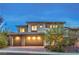Charming home with a three-car garage, desert landscaping, and a welcoming entrance at 12404 Aster Hills Ave, Las Vegas, NV 89138