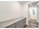 Hallway featuring grey cabinets offering ample storage space at 12404 Aster Hills Ave, Las Vegas, NV 89138