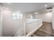 Upstairs hallway featuring wood flooring, recessed lighting, and a white railing around the staircase at 12404 Aster Hills Ave, Las Vegas, NV 89138