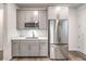 Efficient kitchen with sleek stainless steel appliances, light grey cabinets, and granite countertops at 12404 Aster Hills Ave, Las Vegas, NV 89138