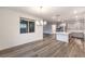 Bright kitchen features gray cabinets, stainless steel appliances and a large island with a white countertop at 12404 Aster Hills Ave, Las Vegas, NV 89138