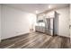 Stylish eat-in kitchen with gray cabinets, stainless steel appliances and wood-look floors at 12404 Aster Hills Ave, Las Vegas, NV 89138
