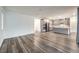An open concept shows an amazing kitchen with gray cabinets, stainless steel appliances, and an island at 12404 Aster Hills Ave, Las Vegas, NV 89138