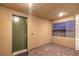 A cozy outdoor patio with a tiled floor and view into the backyard at 12404 Aster Hills Ave, Las Vegas, NV 89138