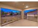 Enjoy outdoor living on this patio with modern railings and neighborhood views at dusk at 12404 Aster Hills Ave, Las Vegas, NV 89138