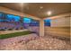 Spacious patio with brick floors, serene landscaping, privacy walls, and a picturesque backdrop at 12404 Aster Hills Ave, Las Vegas, NV 89138
