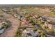 Expansive aerial view of a luxury community with a golf course, lush landscaping, and stunning architecture at 1383 Opal Valley St, Henderson, NV 89052