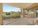Expansive covered balcony with seating area overlooking lush greenery and mountain views at 1383 Opal Valley St, Henderson, NV 89052