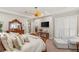 Inviting bedroom with a decorative ceiling fan, wood furniture, and plantation shutters at 1383 Opal Valley St, Henderson, NV 89052