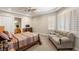 Cozy bedroom with a couch and window shutters, creating a relaxing space at 1383 Opal Valley St, Henderson, NV 89052