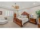 Comfortable bedroom with a decorative ceiling fan, wood furniture, and plantation shutters at 1383 Opal Valley St, Henderson, NV 89052