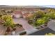 Attractive two-story home boasting a spacious driveway, lush landscaping, and a well-maintained lawn at 1383 Opal Valley St, Henderson, NV 89052