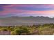 Scenic view capturing a vibrant pink and blue sunset over rolling mountains at 1383 Opal Valley St, Henderson, NV 89052