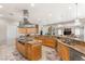 Open kitchen with stainless steel appliances and a central island cooktop at 1383 Opal Valley St, Henderson, NV 89052