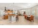 Open-concept kitchen with dining, living, and island bar, great for entertaining at 1383 Opal Valley St, Henderson, NV 89052