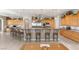 Large kitchen featuring a large island, bar seating, and stainless steel appliances at 1383 Opal Valley St, Henderson, NV 89052