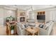 Bright living room features a stone fireplace, neutral furniture, and ceiling fan at 1383 Opal Valley St, Henderson, NV 89052