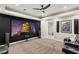 Basement theater room with a large screen, ceiling fan, and comfortable seating at 1383 Opal Valley St, Henderson, NV 89052