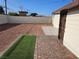 Spacious backyard features gravel, brick pavers, and an artificial grass accent for low maintenance enjoyment at 1720 Eastwood Dr, Las Vegas, NV 89104