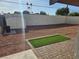 Gravel backyard with artificial turf, brick patio, and storage shed at 1720 Eastwood Dr, Las Vegas, NV 89104