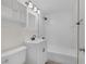 Updated bathroom featuring sleek, white subway tile and modern fixtures at 1720 Eastwood Dr, Las Vegas, NV 89104