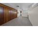 Spacious bedroom with wood-look floors, wood paneled accent wall, and lots of natural light at 1720 Eastwood Dr, Las Vegas, NV 89104