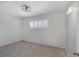 Bright bedroom featuring wood-look tile flooring and plantation shutters at 1720 Eastwood Dr, Las Vegas, NV 89104