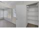 Hallway boasts wood-look floors, natural light from shuttered windows, and a storage closet at 1720 Eastwood Dr, Las Vegas, NV 89104