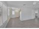 Bright living room featuring wood-look flooring, white walls, and ample natural light from shuttered windows at 1720 Eastwood Dr, Las Vegas, NV 89104